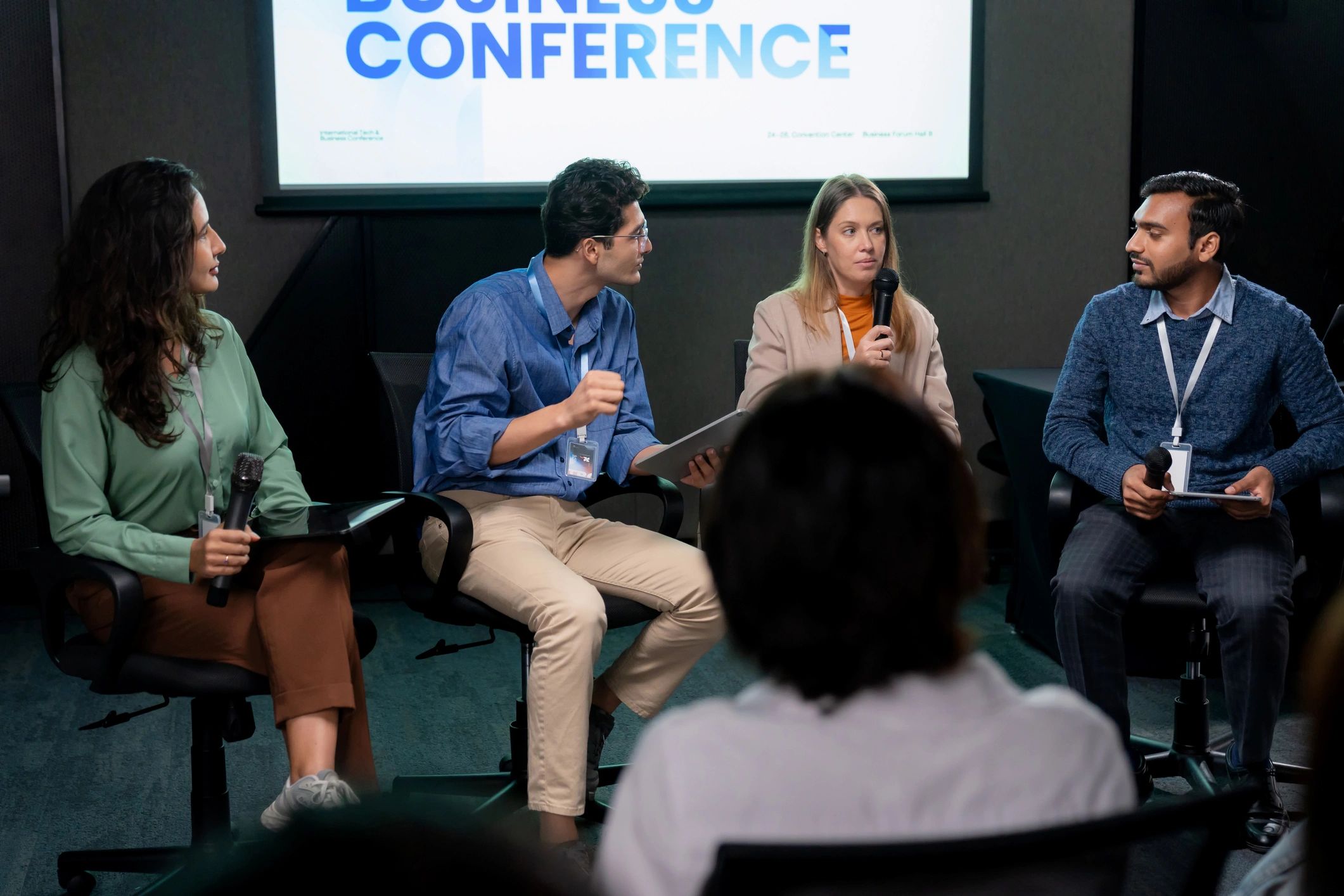 Leadership panel speaking at a business conference